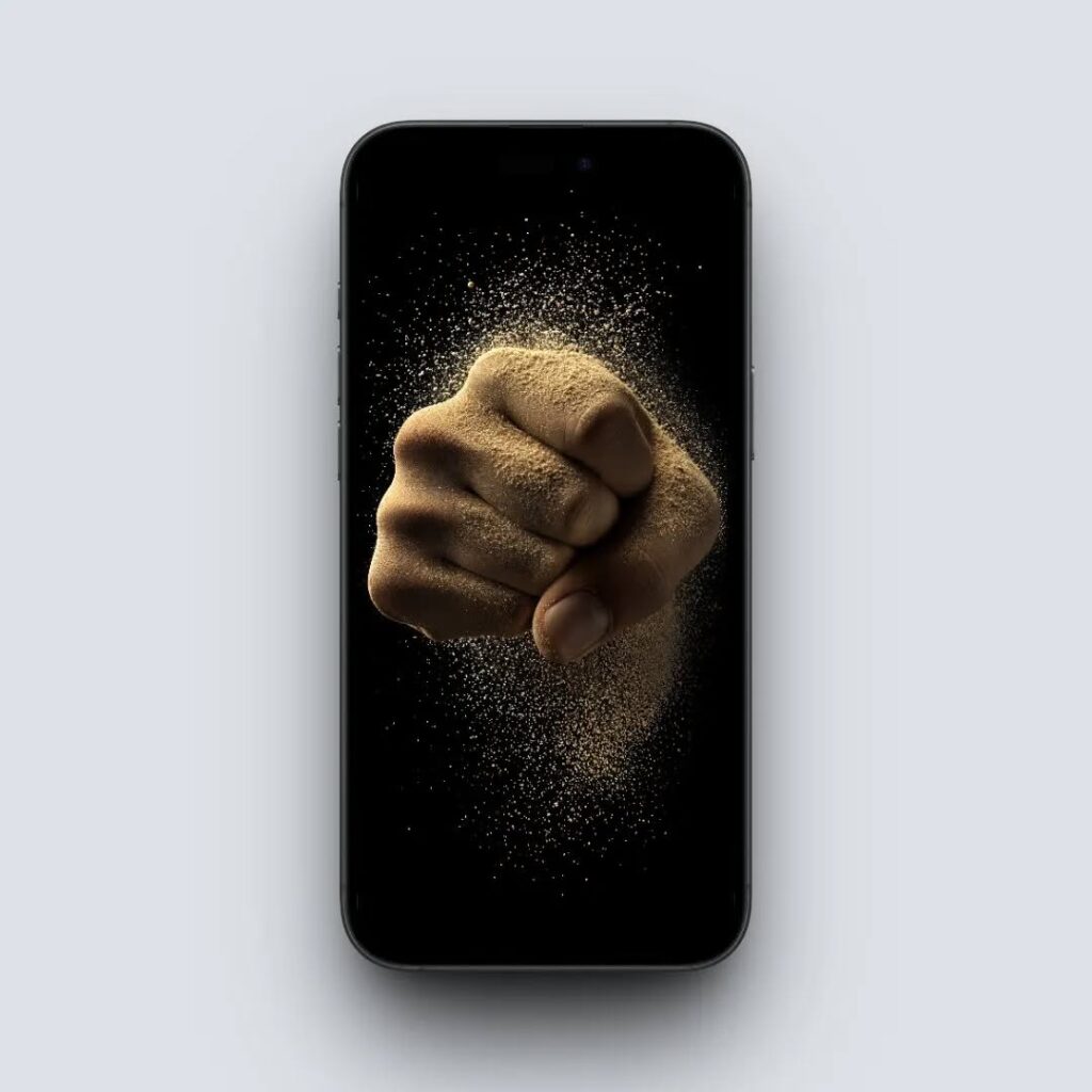 4K Crumbling Fist Wallpaper Mockup: The wallpaper displayed on a phone screen.